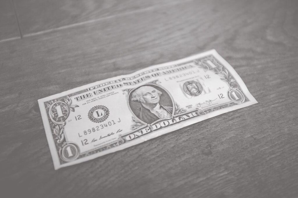 Dollar bill representing freelancers and consultants fees in proposal management and writing