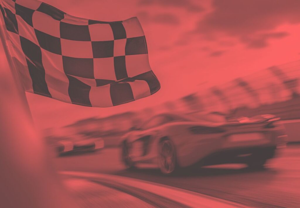 Chequered flag above racing cars, with a red colour overlay